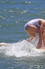 MARGOT ROBBIE in Swimsuit Surfing in Hawaii 07/19/2016