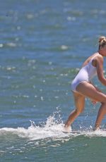 MARGOT ROBBIE in Swimsuit Surfing in Hawaii 07/19/2016