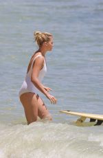 MARGOT ROBBIE in Swimsuit Surfing in Hawaii 07/19/2016