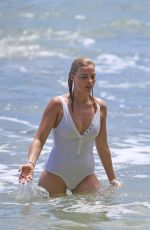 MARGOT ROBBIE in Swimsuit Surfing in Hawaii 07/19/2016