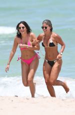 NATASHA OAKLEY and DEVIN BRUGMAN in Bikinis at a Beach in Miami 07/15/2016