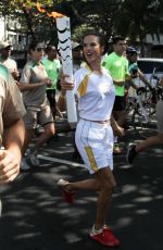 ALESSANDRA AMBROSIO Runs with Olympic Flame Through Rio De Janeiro 08/05/2016