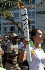 ALESSANDRA AMBROSIO Runs with Olympic Flame Through Rio De Janeiro 08/05/2016