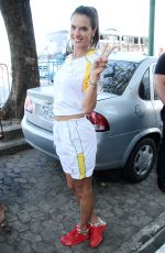 ALESSANDRA AMBROSIO Runs with Olympic Flame Through Rio De Janeiro 08/05/2016