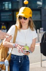 EMILIA CLARKE at Heathrow Airport in London 08/23/2016