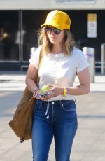 EMILIA CLARKE at Heathrow Airport in London 08/23/2016