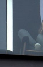 GISELE BUNDCHEN on the Balcony of Her Hotel in Rio De Janeiro 08/03/2016