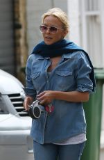 KYLIE MINOGUE Walks Her Dog Out in London 08/03/2016