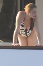 LINDSAY LOHAN in Swimsuit at a Yacht in Sardinia 07/30/2016