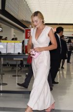 MARGOT ROBBIE Arrives at Airport in Tokyo 08/24/2016