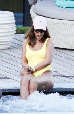 RIHANNA in Swimsuit at Pool at her Hotel in Zurich 08/13/2016