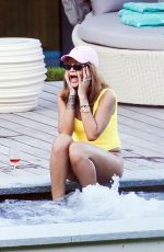 RIHANNA in Swimsuit at Pool at her Hotel in Zurich 08/13/2016
