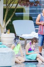 RIHANNA in Swimsuit at Pool at her Hotel in Zurich 08/13/2016