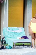 RIHANNA in Swimsuit at Pool at her Hotel in Zurich 08/13/2016