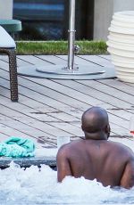 RIHANNA in Swimsuit at Pool at her Hotel in Zurich 08/13/2016