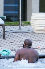 RIHANNA in Swimsuit at Pool at her Hotel in Zurich 08/13/2016