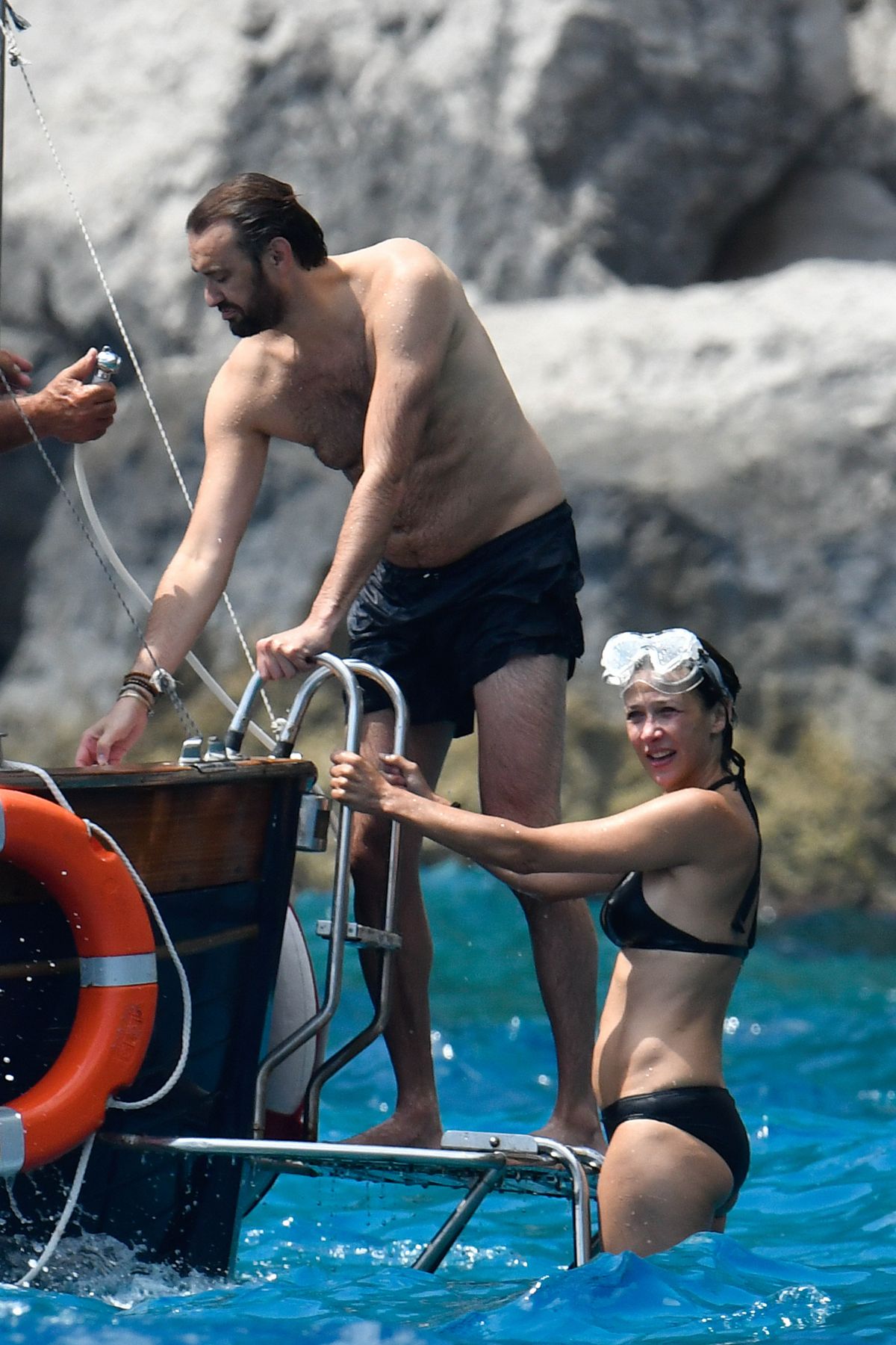 SOPHIE MARCEAU in Bikini at a Boat in Capri 07/31/2016.