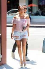 ADRIENNE BAILON in Ripped Shorts Out in Beverly Hills 08/28/2016