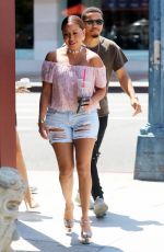 ADRIENNE BAILON in Ripped Shorts Out in Beverly Hills 08/28/2016