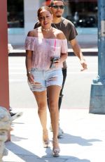 ADRIENNE BAILON in Ripped Shorts Out in Beverly Hills 08/28/2016