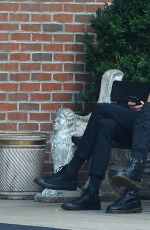 ALEXA CHUNG Having a Smoke Break in New York 09/05/2016