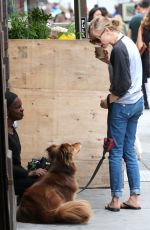 AMANDA SEYFRIED Walks Her Dog Out in New York 09/05/2016