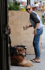 AMANDA SEYFRIED Walks Her Dog Out in New York 09/05/2016