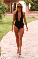 AMBER DOWDING in Swimsuit Leaves Her Hotel in Marbella 09/25/2016