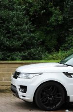 CHLOE KHAN Washing Her Range Rover in a Bikini Top and Cut Off in London 09/20/2016