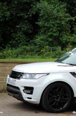 CHLOE KHAN Washing Her Range Rover in a Bikini Top and Cut Off in London 09/20/2016