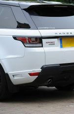 CHLOE KHAN Washing Her Range Rover in a Bikini Top and Cut Off in London 09/20/2016
