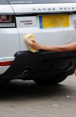 CHLOE KHAN Washing Her Range Rover in a Bikini Top and Cut Off in London 09/20/2016