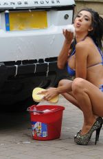 CHLOE KHAN Washing Her Range Rover in a Bikini Top and Cut Off in London 09/20/2016