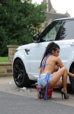 CHLOE KHAN Washing Her Range Rover in a Bikini Top and Cut Off in London 09/20/2016