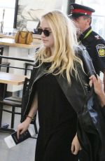 DAKOTA FANNING at Airport in Toronto 09/13/2016