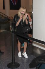 DAKOTA FANNING at Los Angeles International Airport 08/31/2016