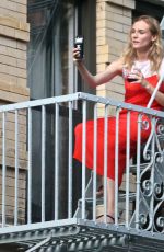 DIANE KRUGER Sipped Wine on Her Fire Escape in New York 09/06/2016