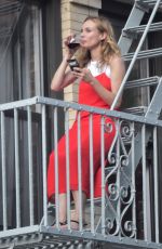 DIANE KRUGER Sipped Wine on Her Fire Escape in New York 09/06/2016