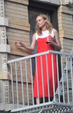 DIANE KRUGER Sipped Wine on Her Fire Escape in New York 09/06/2016