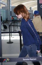EMMA STONE Arrives at Pearson International Airport in Toronto 09/14/2016