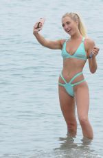 GEORGE HARRISON in Bikini on the Beach in Barcelona 08/27/2016
