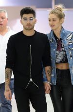 GIGI HADID and Zayn Malik at JFK Airport in New York 09/15/2016