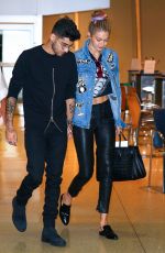 GIGI HADID and Zayn Malik at JFK Airport in New York 09/15/2016