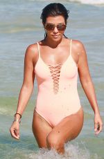 KOURTNEY KARDASHIAN in Swimsuit oat a Beach in Miami 09/17/2016