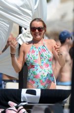 LINDSAY LOHAN in Swimsuit at a Beach in Mykonos 08/31/2016