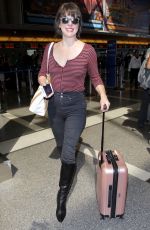 MILLA JOVOVICH at Los Angeles International Airport 09/28/2016