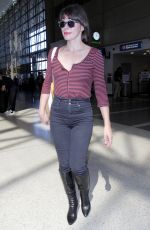 MILLA JOVOVICH at Los Angeles International Airport 09/28/2016