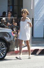 SARAH HYLAND in a White Mini Dress Out in Los Angeles 09/17/2016