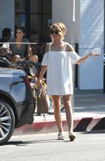 SARAH HYLAND in a White Mini Dress Out in Los Angeles 09/17/2016