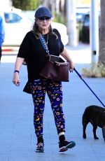 CARRIE FISHER Walks Her Dog Out in Los Angeles 09/29/2016